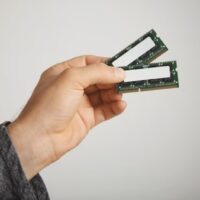 Person hand holding a Random Access Memory