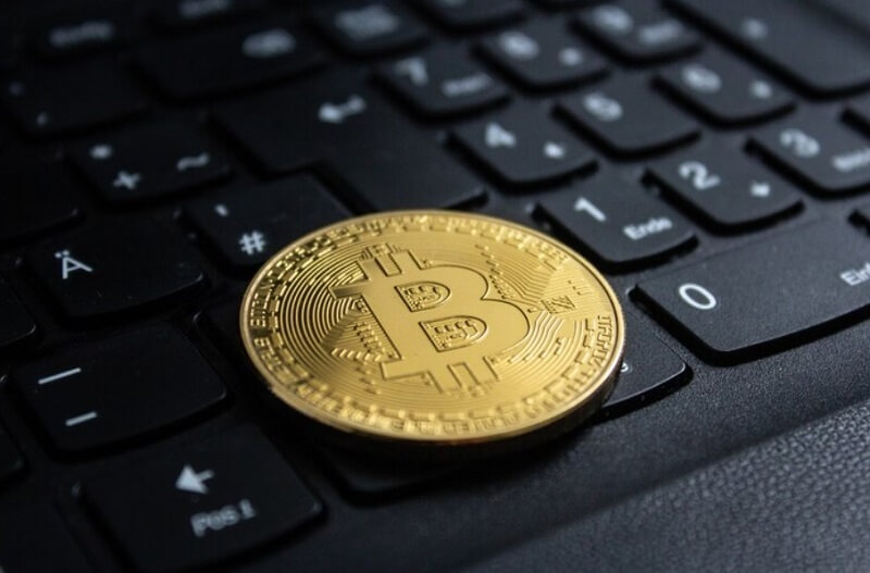bitcoin on a laptop keyboard