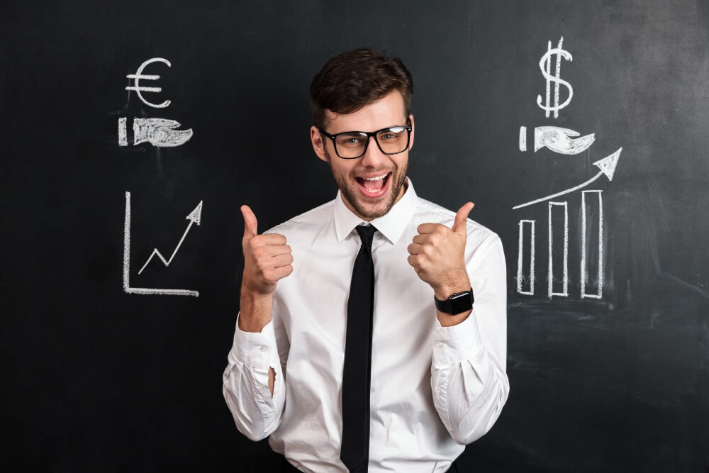 Businessman showing thumb up gesture in Cost Efficiency