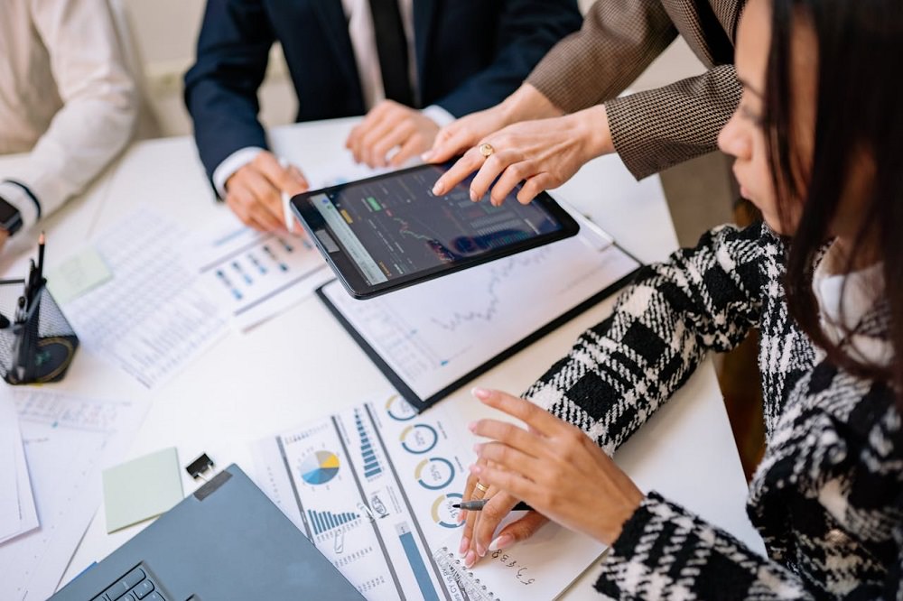 Woman Looking at Data on an iPad Screen